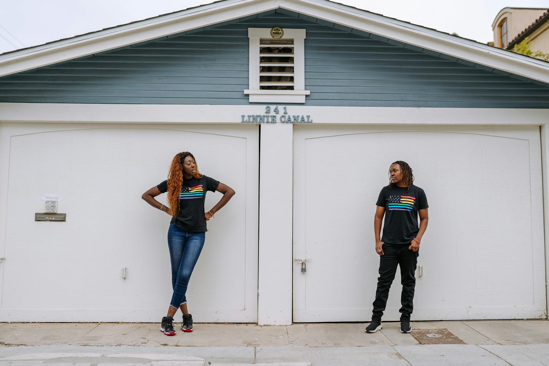 couple standing in front of a car port